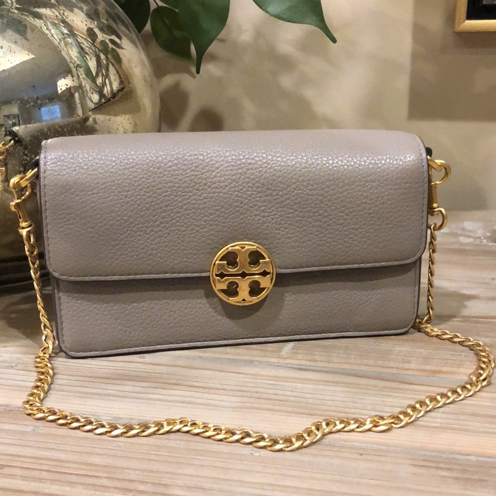 Like new Tori Burch leather purse, emblem is brushed finish.,carried 4/5 times.